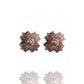 Pair of rose gold floral earrings with pearl centers on a white background