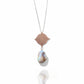 Rose Gold Necklace with a pendant featuring a large pearl and intricate design on a white background
