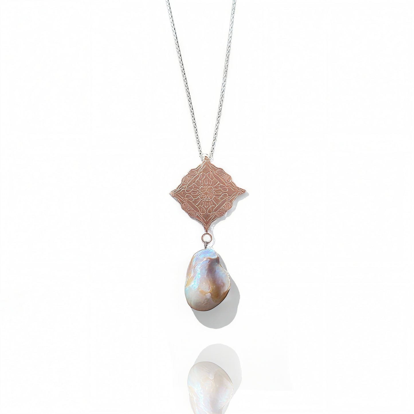Rose Gold Necklace with a pendant featuring a large pearl and intricate design on a white background