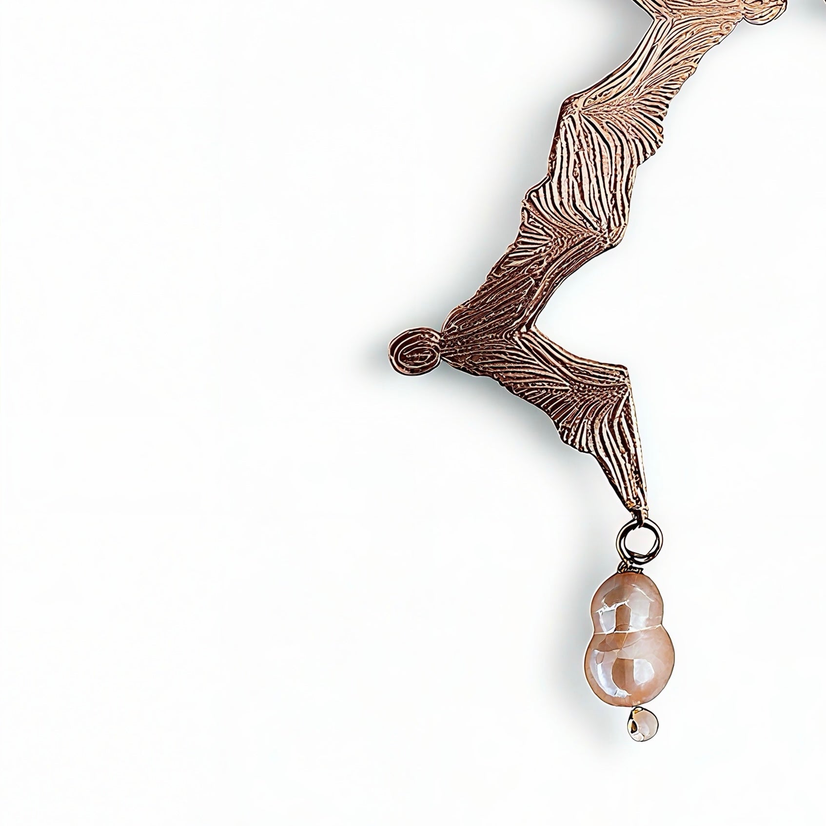 Rose gold earrings with peach pearls detail