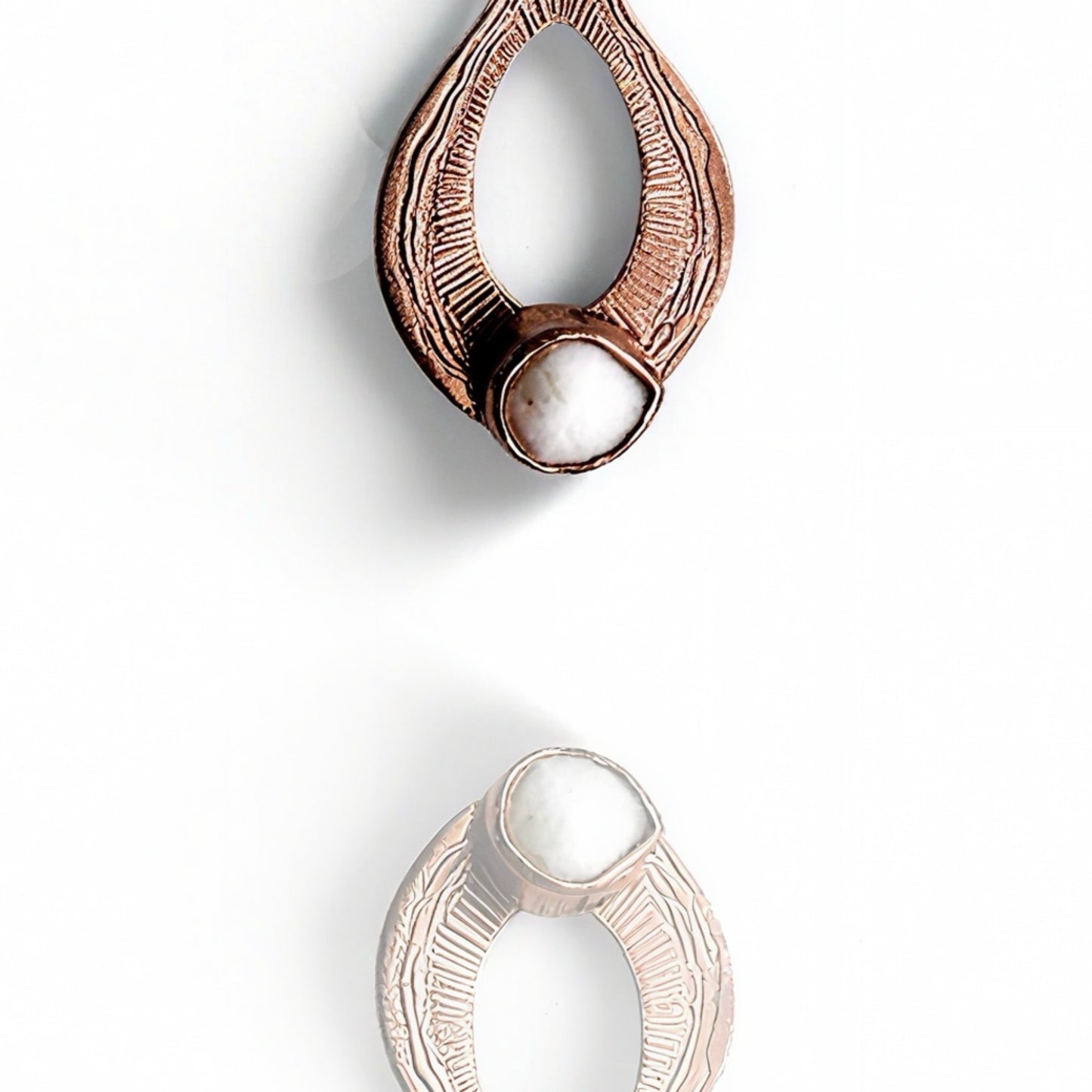 Closeup of a rose gold necklace with pearl